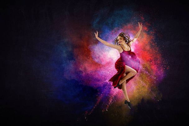 Female dancer against colourful background - Φωτογραφία, εικόνα