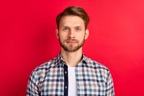 Photo of young handsome man happy positive smile confident wear plaid shirt isolated over red color background - 写真・画像