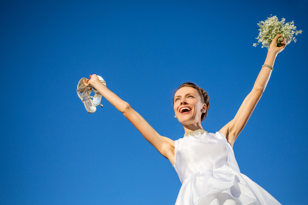 Happy bride over blue sky - Photo, Image