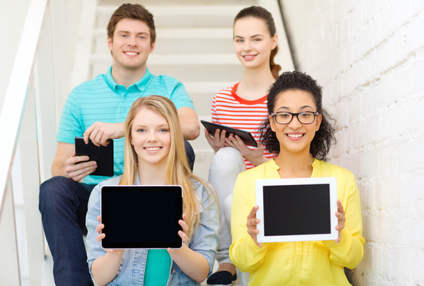 smiling students showing tablet pc blank screen - Photo, image