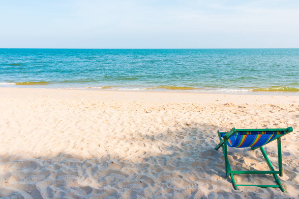 empty wooden beach chair at the beach background - 写真・画像