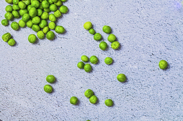 Fresh green peas on blue concrete table  background - Photo, image