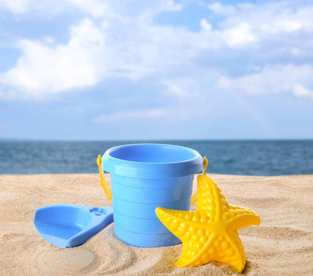 Set of beach toys for children on sandy beach - Zdjęcie, obraz
