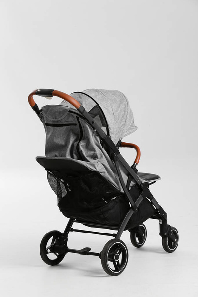 Modern baby stroller on white background - Fotó, kép