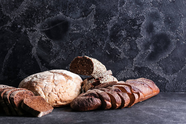 Fresh bread on dark background - 写真・画像