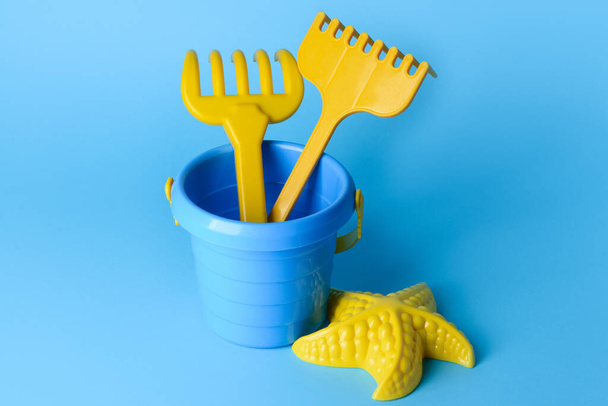 Set of beach toys for children on color background - Фото, зображення