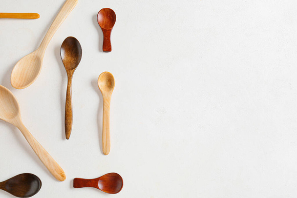 Different wooden spoons on white background - Photo, Image