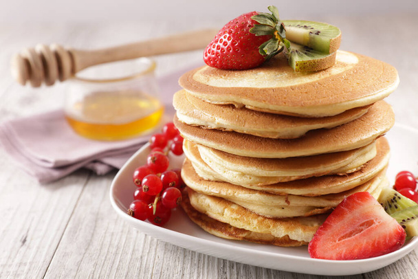 pile of pancakes and berries fruits - 写真・画像