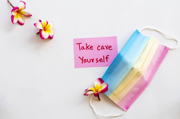 take care yourself message card handwriting with colorful mask for health care covid19 arrangement postcard style on background white  - Photo, Image
