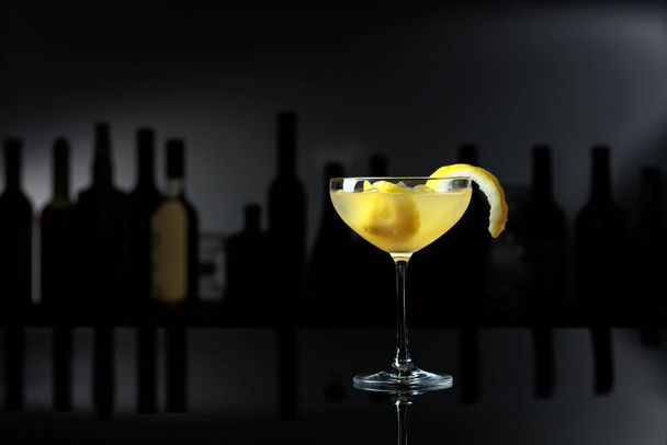 Cocktail "Sidecar" on a black reflective background. Copy space. - Photo, Image