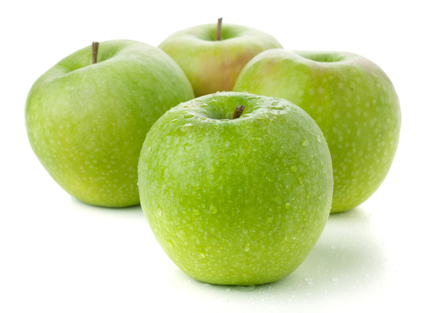 Cuatro manzanas verdes maduras. Aislado sobre blanco
 - Foto, imagen