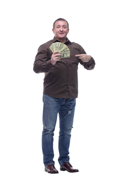 in full growth. smiling man with a fan of dollar bills . - 写真・画像