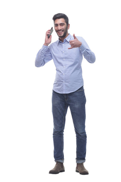 in full growth. happy man talking on a mobile phone. - Фото, зображення