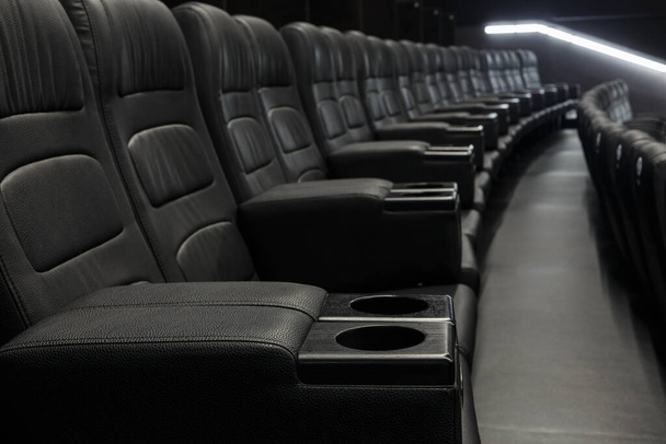 Empty Black Leather Seats In Row At Movie Theater - great entertainment fun background image - Фото, изображение