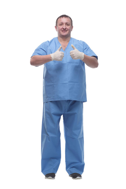 doctor in protective gloves showing thumbs up. - Foto, Bild
