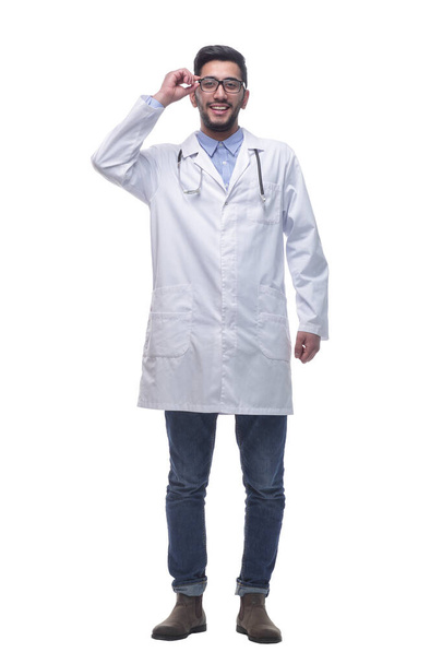 smiling doctor looking through glasses . isolated on a white background. - Foto, imagen