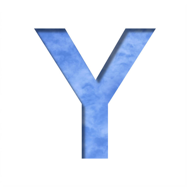 Font on blue sky. Letter Y cut out of paper on a background of a bright blue sky with light clouds. Set of decorative natural fonts - Photo, Image