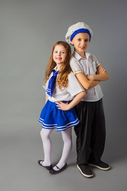 The happy little couple in a sailors costumes - Fotó, kép