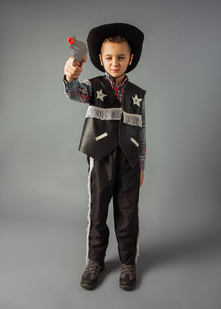 The little boy in a sheriffs costume full length - Photo, Image