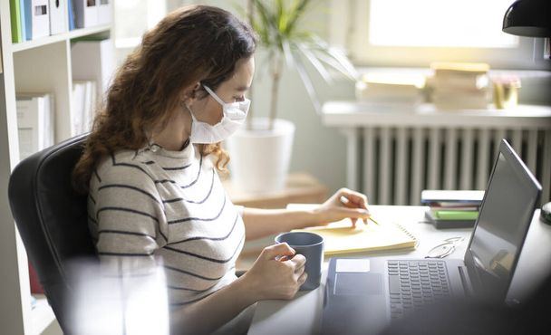 Young woman working from home after coronavirus pandemic - Fotografie, Obrázek