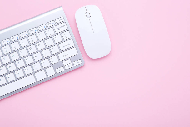 Computer keyboard and mouse on pink background - Fotoğraf, Görsel