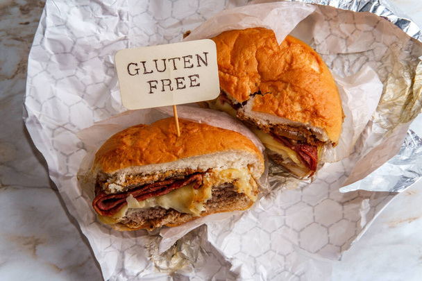 American beef hamburger with turkey bacon mushrooms and swiss cheese on gluten-free bun - Photo, Image