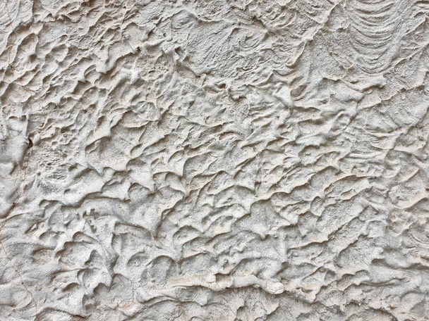 textured colored facing plaster of the street wall of the building - Photo, Image
