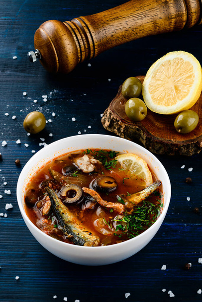 fish soup solyanka with olives and lemon, Solyanka spicy and sour soup, Russian soup with fish - Valokuva, kuva