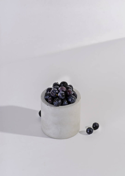 blueberries in a glass of concrete - Foto, imagen