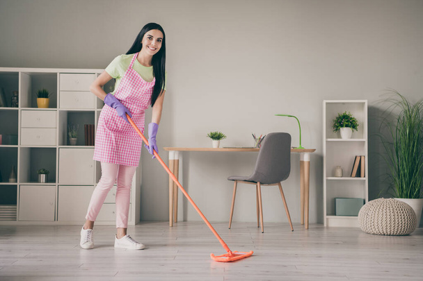 Full length body size view of pretty cheerful long-haired girl cleansing floor tidy cleanup service hygiene at light interior room - Фото, зображення