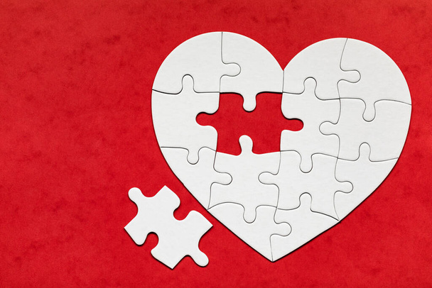 Heart object made of puzzle pieces. Make complete heart. Jigsaw puzzle pieces in form of heart. Happy Valentines Day, greeting card template. Heart jigsaw puzzle. - Photo, Image