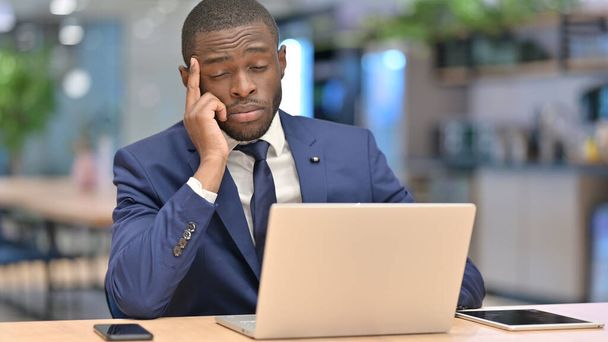 Stressed African Businessman with Laptop having Headache in Office  - Foto, Imagem
