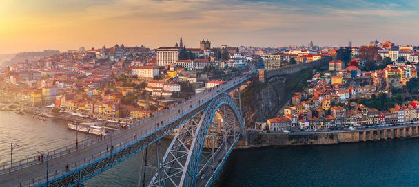 Porto panoramic aerial view of Dom Luis Bridge at sunset. Porto, Portugal. Cityscape of Porto downtown touristic Ribeira - Photo, Image
