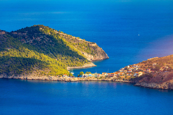 Turquoise Bay in Mediterranean Sea with Colorful Houses in Assos