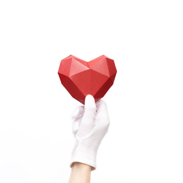 Hand holding red heart on white background. Healht care, love concept. Image for World health day - 写真・画像