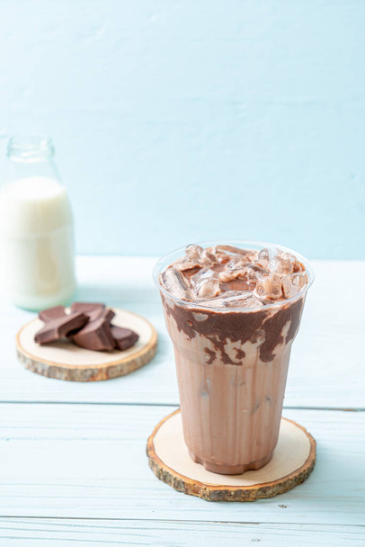 Iced chocolate milkshake drink on wood background - Φωτογραφία, εικόνα