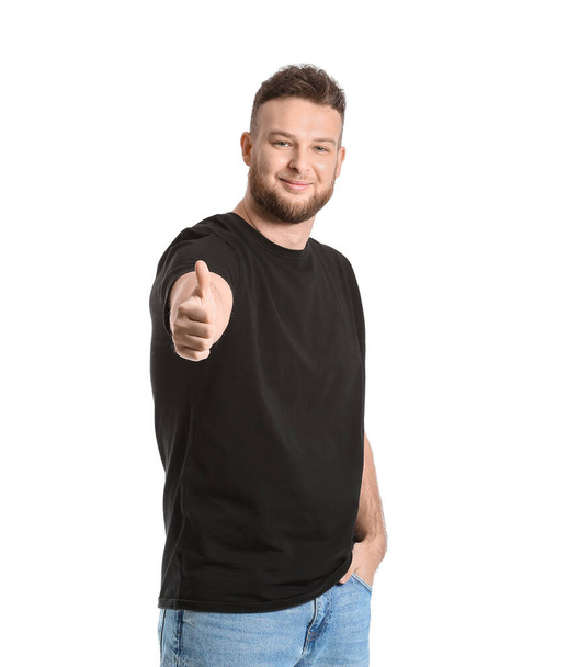 Handsome man showing thumb-up on white background - Foto, imagen