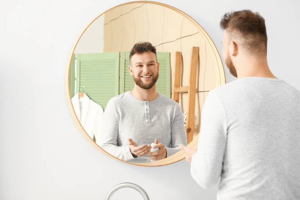Handsome man with shaving foam in bathroom - Zdjęcie, obraz