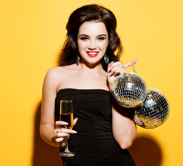 luxury, nightlife, party concept - beautiful woman in evening dress with white wine and disco ball - Φωτογραφία, εικόνα
