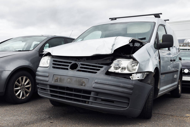 Badly damaged van right off in commercial vehicle recycling or insurance pound - Photo, Image
