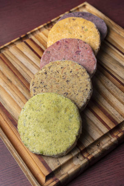 The colorful healthy falafels on a wooden board - Foto, Imagen