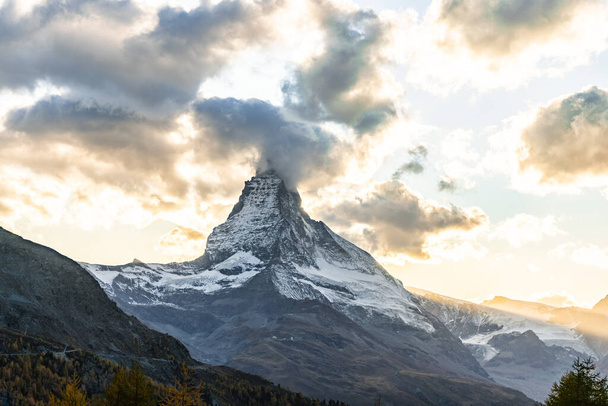 Beautiful autumn landscapes. Amazing sunset in the Swiss Alps, Zermatt, Switzerland, Europe. Incredible autumn view of the Matterhorn - Photo, Image