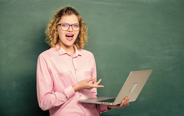 success. modern technology. girl in modern school. happy student in glasses with laptop. teacher woman at blackboard. online education. business school. e-learning concept. Education via Internet - Photo, Image