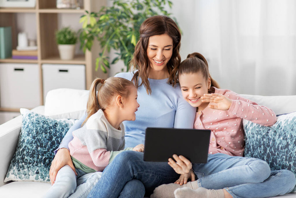 mother and children having video call on tablet pc - Foto, Bild