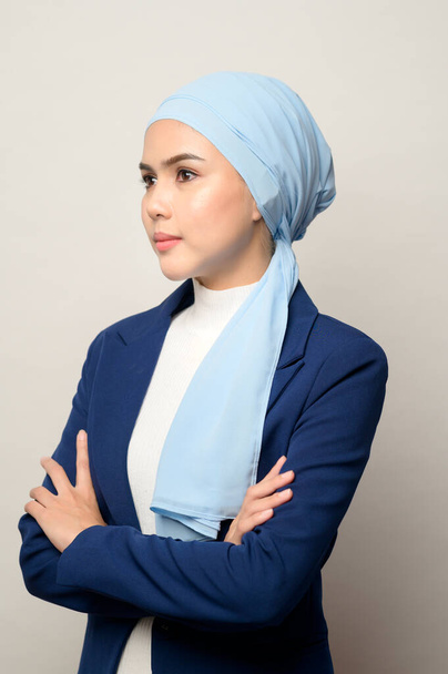 A close up of young beautiful muslim businesswoman with hijab isolated on white background studio - Φωτογραφία, εικόνα
