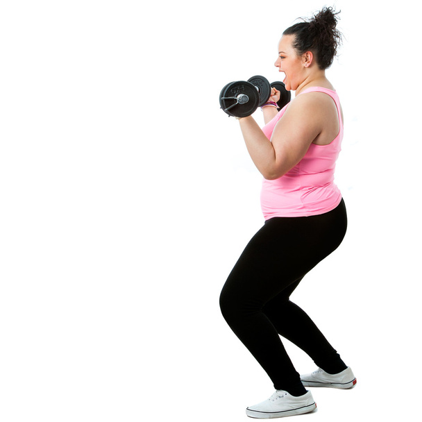 Overweight girl doing workout. - Fotó, kép