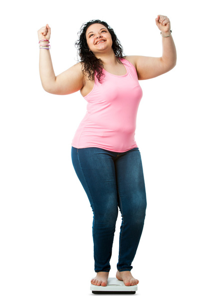 Positive overweight girl on diet scale. - Foto, immagini