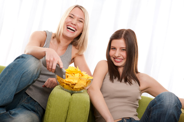 Student series - Two young woman watching TV - Foto, Bild