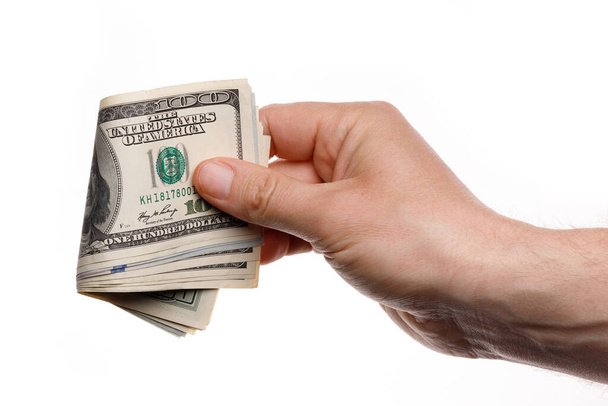 Ruční držení peněz se sto dolarů bankovky izolované na bílém pozadí - Fotografie, Obrázek