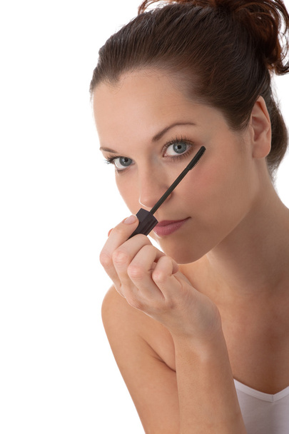 Body care series - Beautiful woman applying mascara - Foto, Imagen